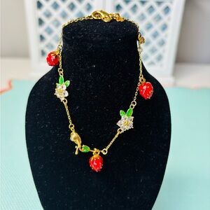 Kate Spade Strawberry Charm Bracelet with snail and crystal flowers. NWT